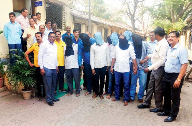 Those arrested in the scam, seen with Thane Crime Branch officials