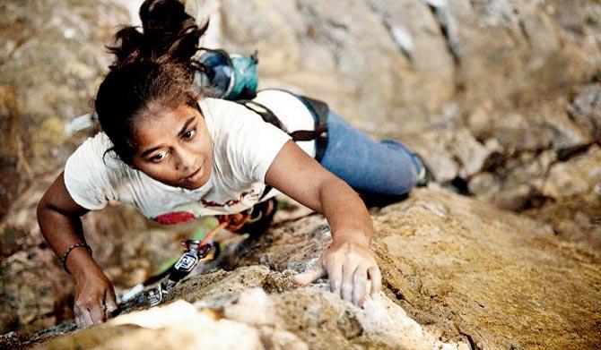 A participant at a climbing competition held at Sasun Navghar, Bhayander