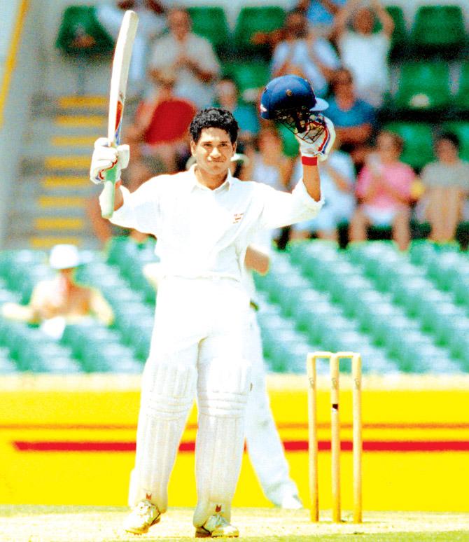 Sachin Tendulkar acknowledges the cheers after reaching his century against Australia at the WACA ground in Perth on February 3, 1992. Pic/AFP