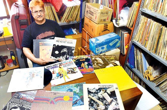 Records dealer Pilak Bhatt at his Kandivli warehouse, with some favourites from his collection. In the absence of iconic music stores in the city today, sources like him importantly keep the LP form alive. Pic/Nimesh Dave