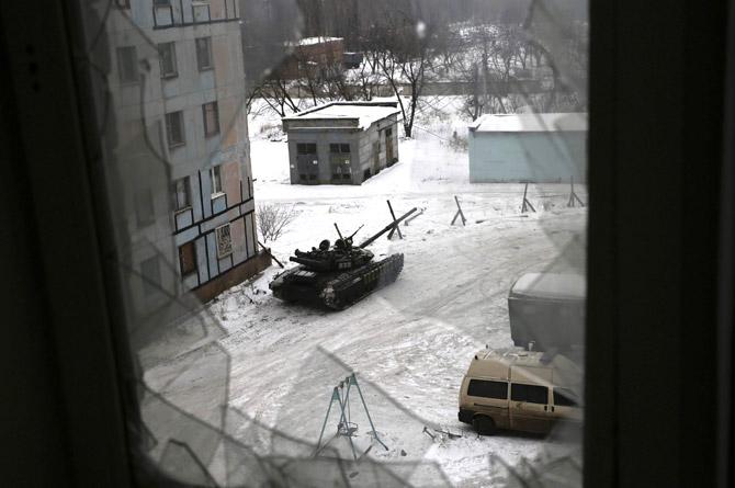 A tank from the Ukrainian Forces is stationed outside a building in the flashpoint eastern town of Avdiivka that sits just north of the pro-Russian rebels