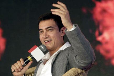 Aamir Khan solves his filmy songs charades!