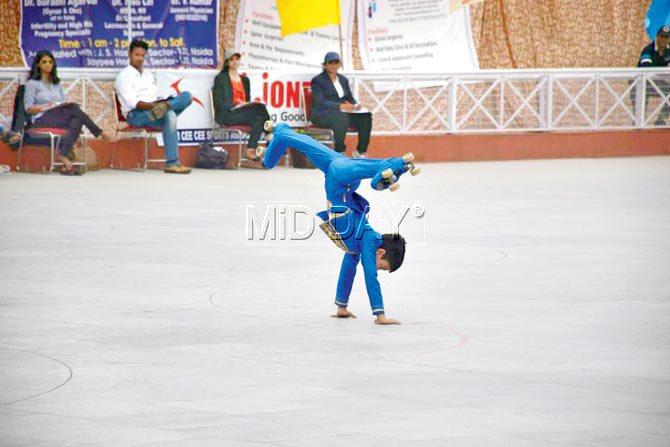 Ansh Marfatia attempts a cartwheel at the 54th National Roller Sports Championships in Noida