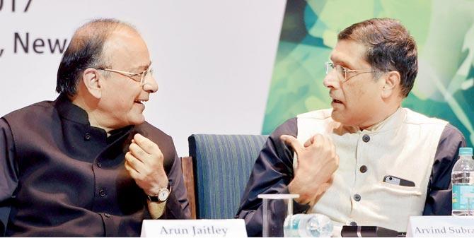 Finance Minister Arun Jaitley (l) with Chief Economic Adviser Arvind Subramanian in New Delhi. Pic/PTI