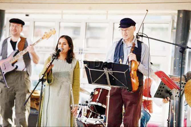 Erika Sandberg jams with her father during a session with intellectually-disabled adults in Sweden