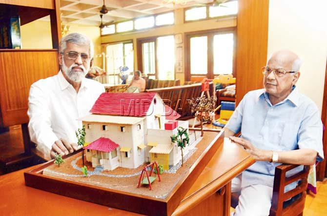 Girish Samant, son of socialist patriot Baburao Samant, and Baburao’s architect brother     Vinayak Samant, flank a model of their ancestral Samantwadi cottage which five generations of the family occupied in east Goregaon since 1891. Pic/Nimesh Dave