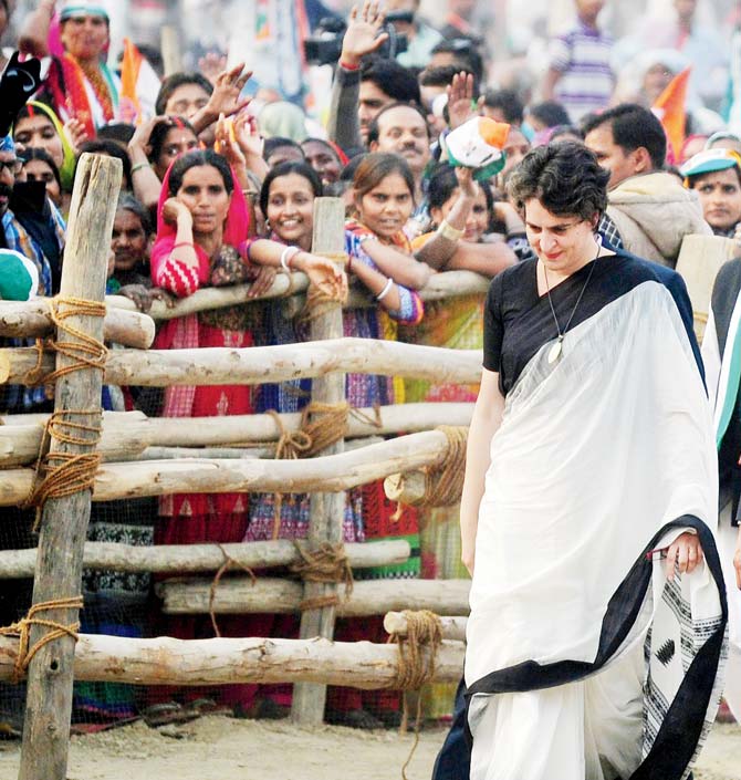 Delighted voters look at Priyanka as she campaigns at Rae Bareli. Pic/AFP