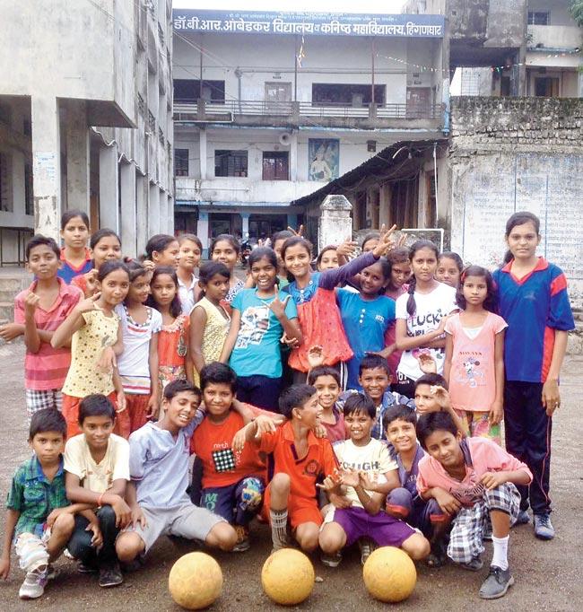 Raghatate (extreme right in blue) with other Slum Soccer kids
