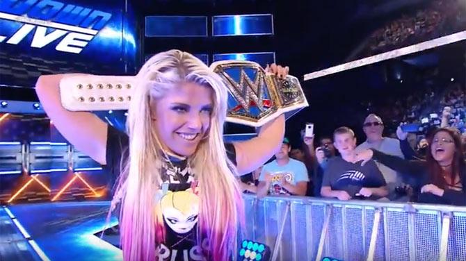 Alexa Bliss with the title