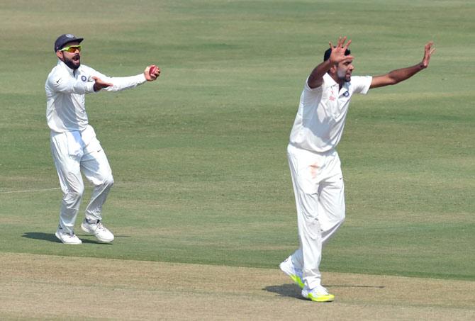 Ashwin and Kohli celebrate a wicket