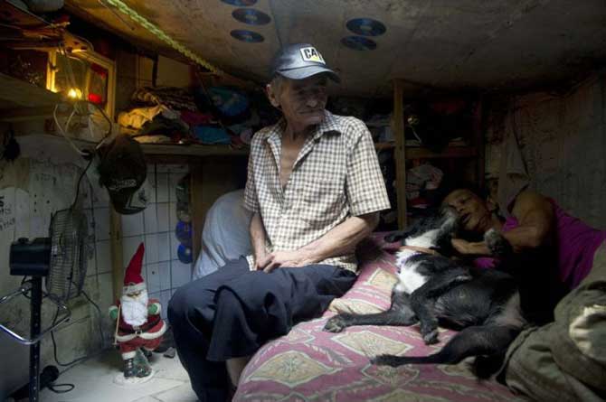 Maria Garcia and her husband, Miguel Restrepo with their pet Blackie