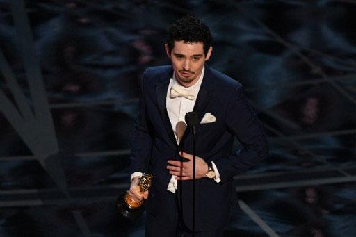 Director Damien Chazelle delivers a speech on stage after he won the Best Director award for "La La Land"at the 89th Oscars on February 26, 2017 in Hollywood, California. 