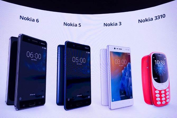 New phone models by Nokia are displayed on a screen during the presentation of the new models "Nokia 6", "Nokia 5", "Nokia 3" and "Nokia 3310" during a press conference on February 26, 2017 in Barcelona on the eve of the start of the Mobile World Congress. AFP PHOTO