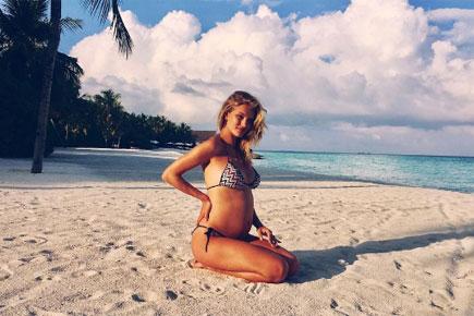 This model just announced her pregnancy with an amazing picture flaunting her baby bump in bikini