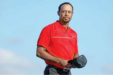 Tiger Woods pulls out of Dubai Desert Classic with back spasm