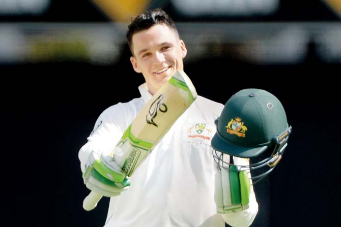 Peter Handscomb of Australia celebrates his century against Pakistan at the Gabba in Brisbane on December 16, 2016. Pics/Getty Images 