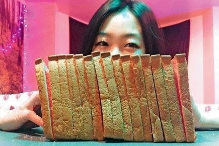 She makes bread sexy! Latest internet craze is smashing your face into bread