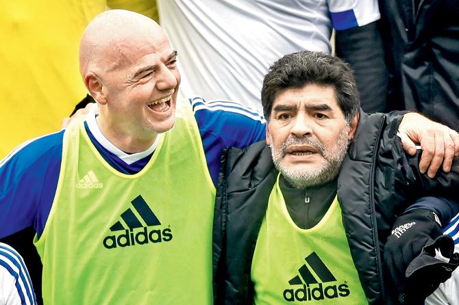 FIFA boss Gianni Infantino (left) with former Argentina footballer Diego Maradona during the FIFA Football Legends match in Zurich, Switzerland yesterday. Pic/AFP