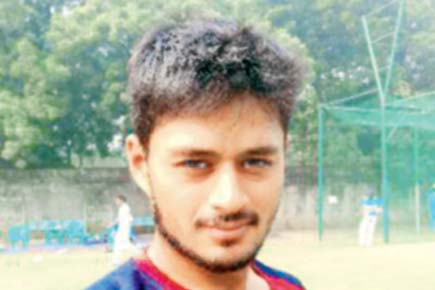 Gujarat Ranji cricketer Priyank Panchal jots down notes in a diary