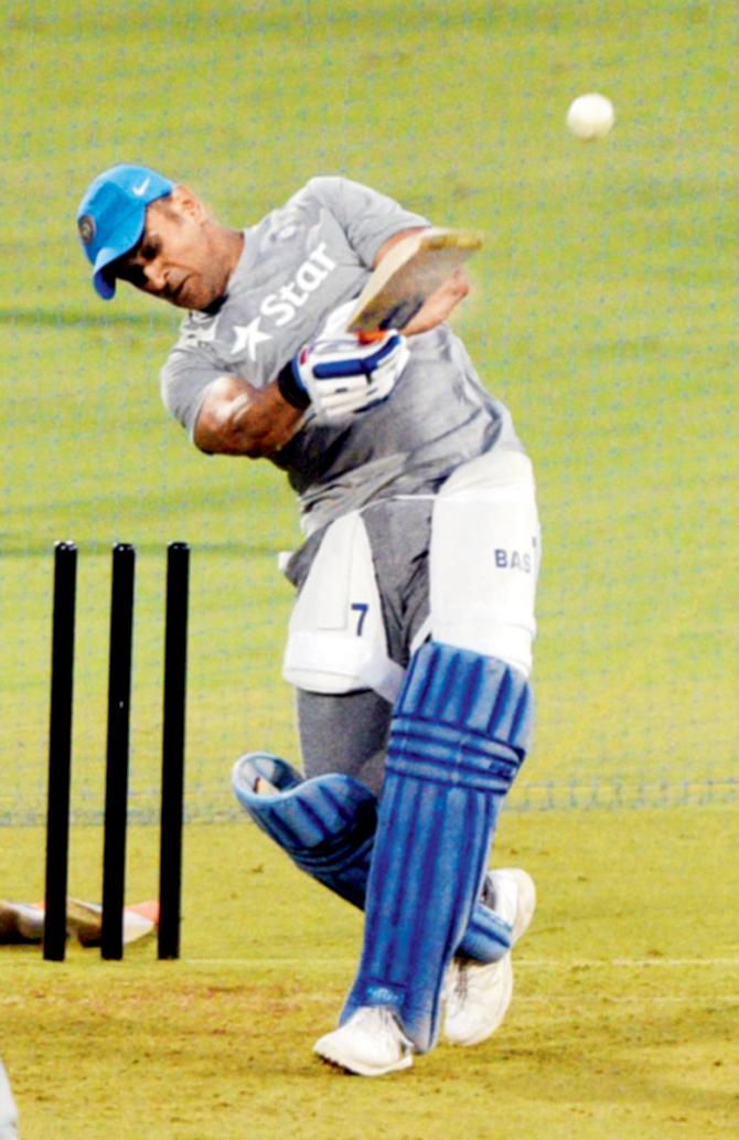 India’s MS Dhoni smashes the ball in the nets at the Cricket Club of India’s Brabourne Stadium yesterday. Pic/Suresh Karkera