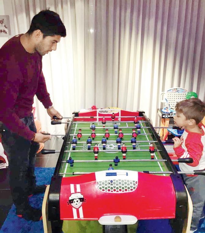An Instagram image of Luis Suarez and his son Benjamin at play