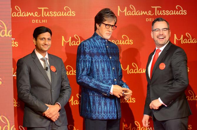 Mr. Anshul Jain and Mr. Marcel Kloos posing with wax figure of Mr. Amitabh Bachchan