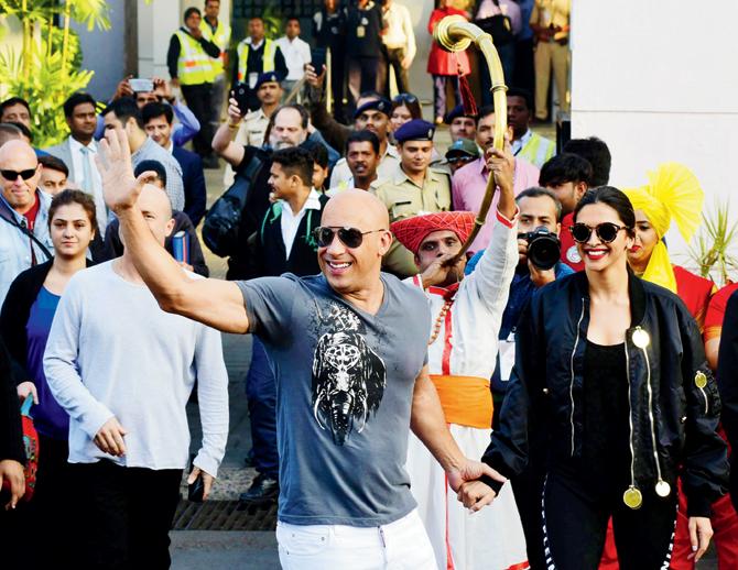 Vin Diesel’s welcome at the airport; with Deepika at the press meet. Pic/Shadab Khan, Sayyed Sameer Abedi