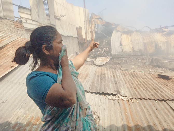 Vijaybai Rathod points to the spot where the blaze occurred
