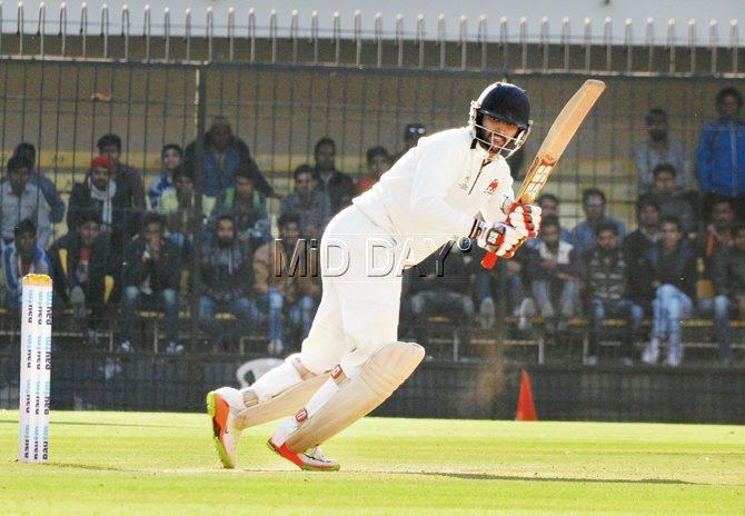 Mumbai’s Nayar plays one on the leg-side against Gujarat  at Indore yesterday.  Pic/Prakash Parsekar