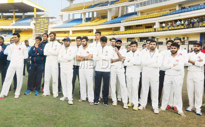 Members of a dejected Mumbai team at the presentation ceremony at Holkar Stadium in Indore on Saturday. Pic/Prakash Parsekar