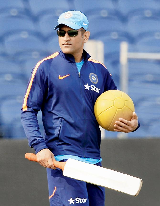 MS Dhoni during a practice session in Pune on Saturday