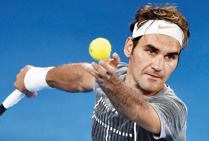 Roger Federer practises at Melbourne Park on Saturday