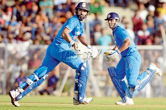 Yuvraj Singh (left) and MS Dhoni during the warm-up match between India ‘A’ and England in Mumbai on Tuesday. Pic/Suresh Karkera