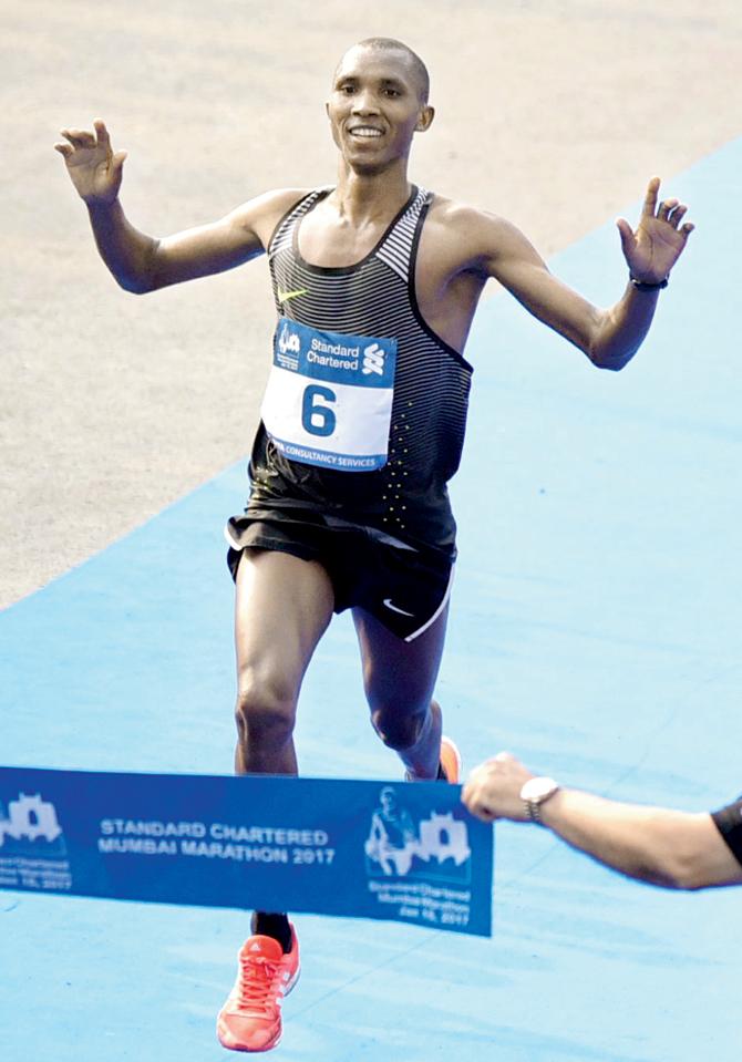 Tanzania’s Simbu crosses the finish line after completing the men’s Elite category marathon at CST station yesterday. Pic/Shadab Khan