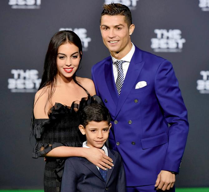 Cristiano Ronaldo with partner Georgina Rodriguez and his son Cristiano Ronaldo Jr. Pic/AFP