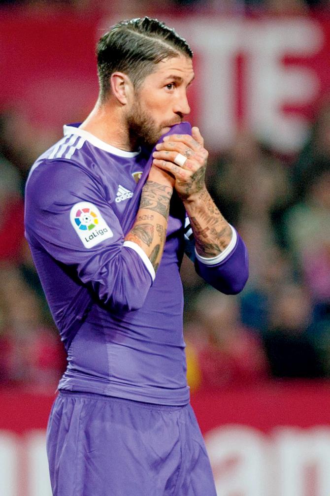 Real Madrid’s Sergio Ramos wears a dejected look after scoring a self goal against Sevilla during a Spanish League encounter at the Ramon Sanchez Pizjuan Stadium in Sevilla on Sunday. Pic/AFP