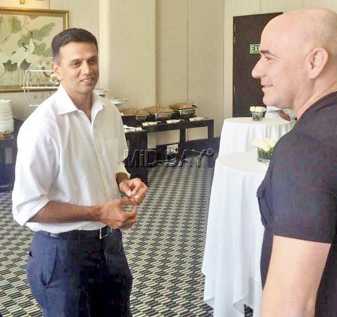 Ex-India cricket captain Rahul Dravid meets Andre Agassi during a promotional event in a city hotel yesterday. Pic/Ashraf Engineer  and Suresh Karkera