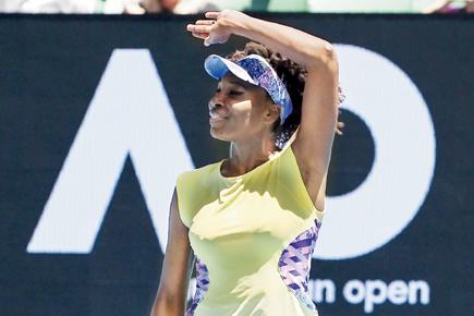 Australian Open: Venus Williams wins despite suffering elbow injury