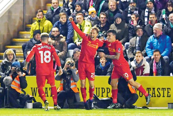 Liverpool’s Lucas (centre) celebrates his goal with teammates vs Plymouth during the FA Cup third round tie on Wednesday. Pic/AFP