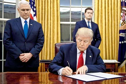 Day 1: President Donald Trump signs executive order against Obamacare
