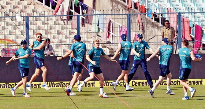 England warm up prior to their practice session on the eve of the third ODI against India at Eden Gardens in Kolkata on Saturday. Pic/PTI