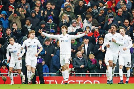 Swansea hand Liverpool shock 3-2 defeat at Anfield