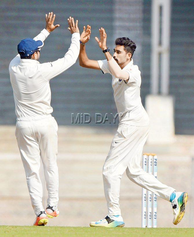 Rest of India’s fast bowler Mohammed Siraj (right) celebrates after dismissing Gujarat batsman Manprit Juneja on the third day of the Irani Cup at the Brabourne Stadium yesterday. Pic/Suresh Karkera