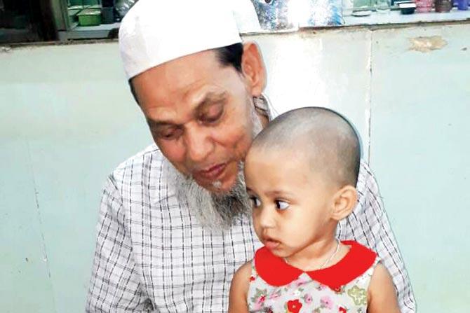 Deceased Abdul Mabud with his granddaughter Almeera, just hours before his death