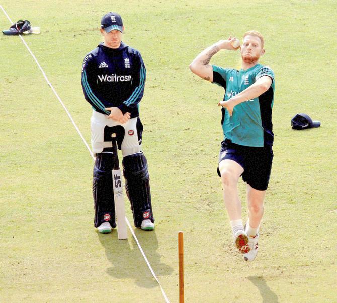 England skipper Eoin Morgan watches all-rounder Ben Stokes bowl during a practice session in Kanpur yesterday. Pic/PTI