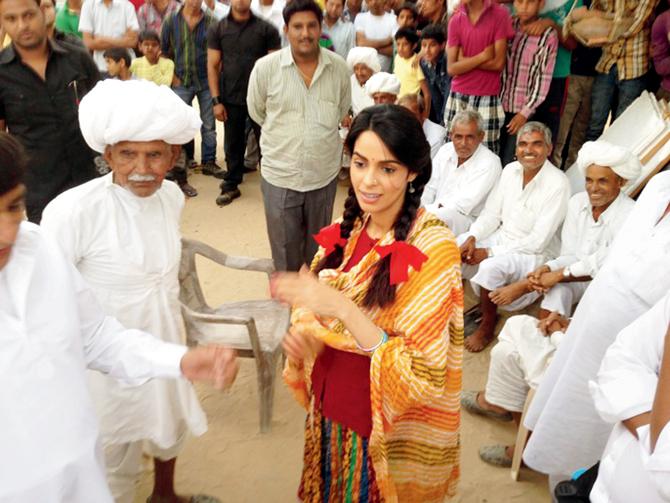 Mallika Sherawat in a still from her last release, Dirty Politics (2015), co-starring late actor Om Puri