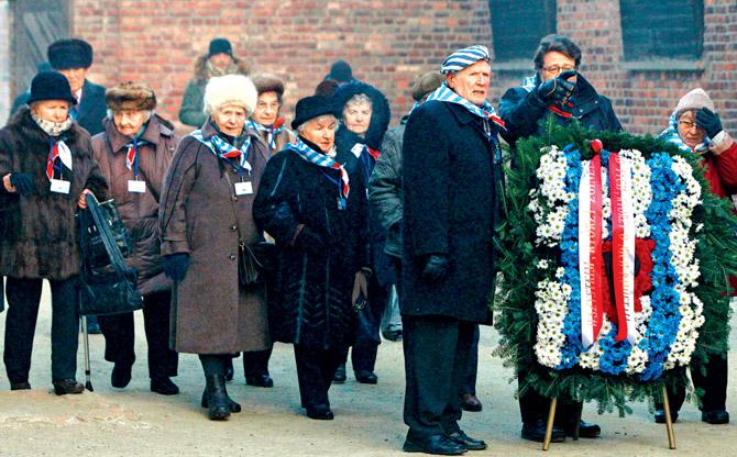 Holocaust survivors lay wreaths at the former Auschwitz Germany Nazi death camp in Poland. Pic/AP