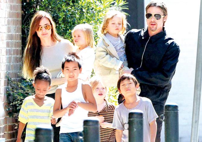 Brad Pitt, with ex-wife Angelina Jolie and Maddox and other kids