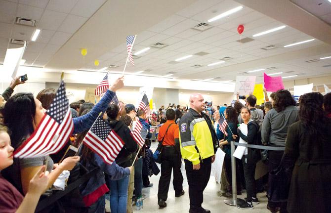 Protesters gather to denounce President Donald Trump