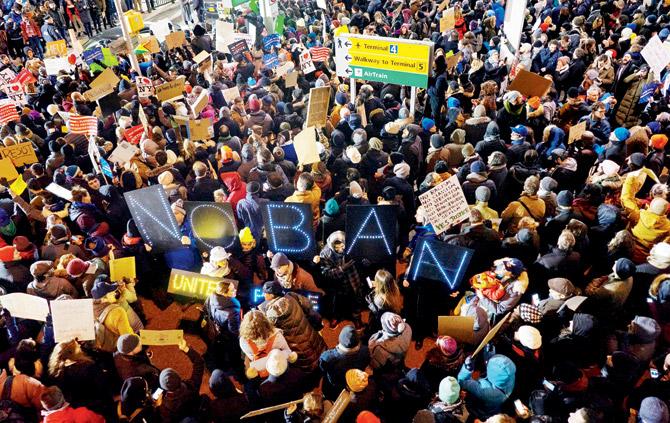 Thousands of protesters assemble at John F Kennedy International Airport in New York to protest the visa ban. Pics/AP